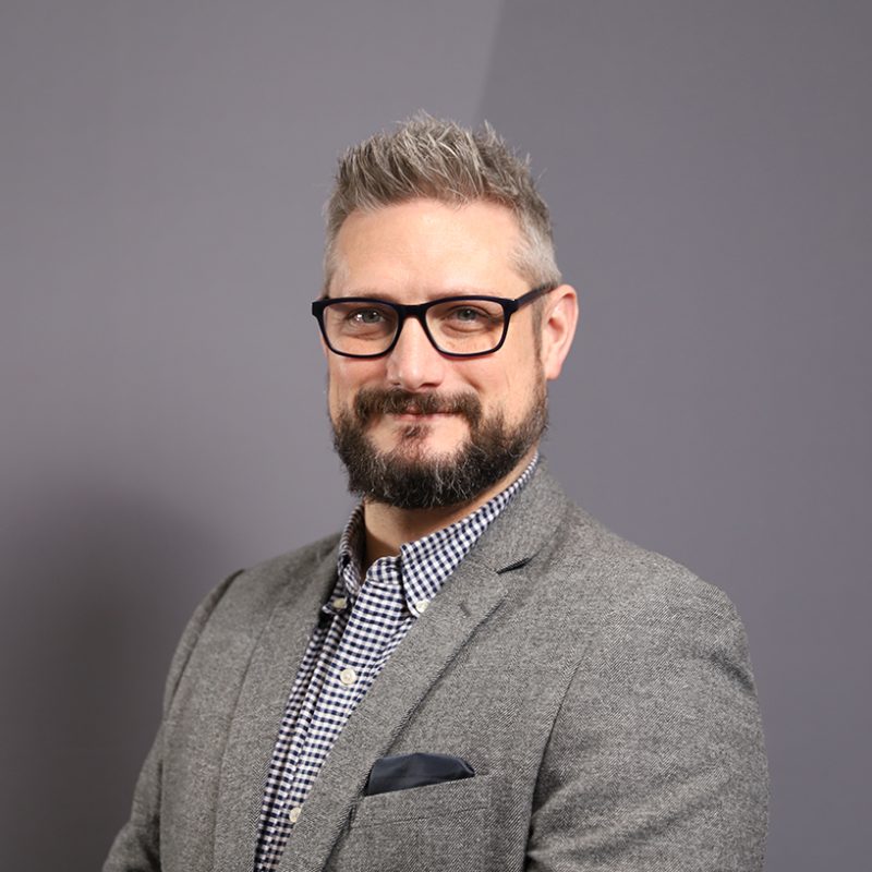 Headshot of Chris Grindey